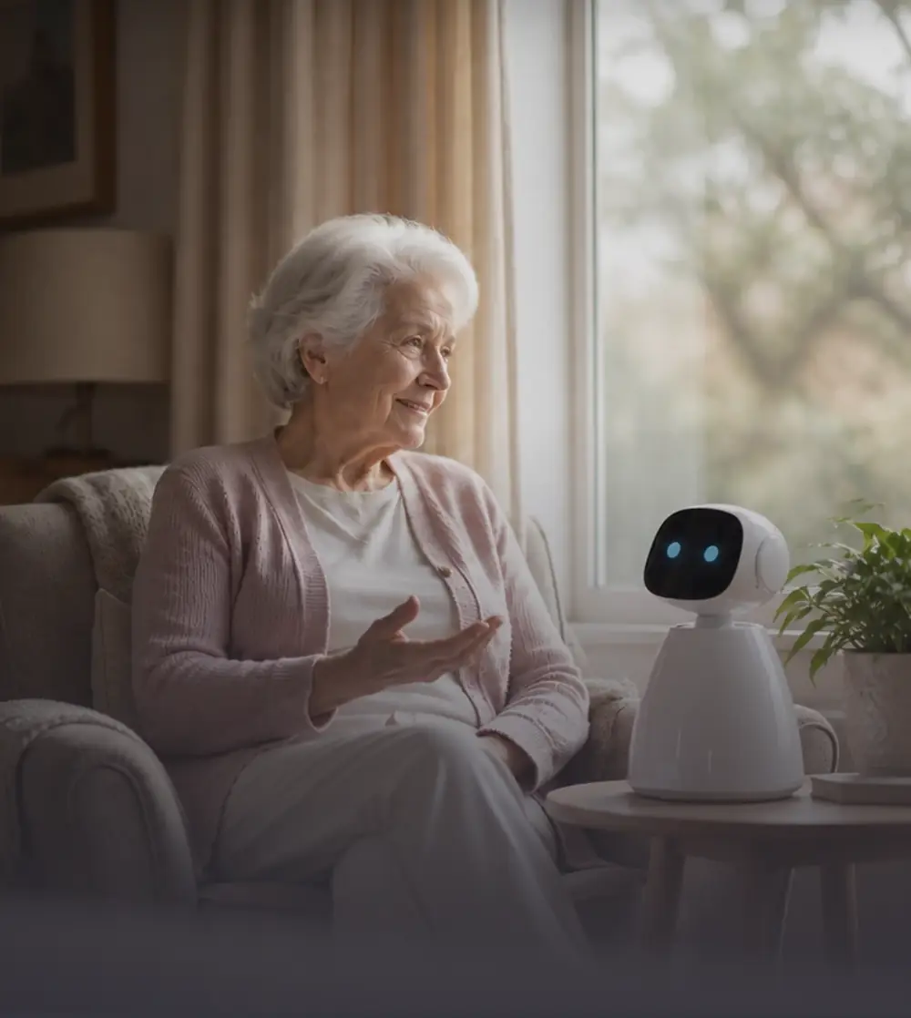 An older woman smiling and talking with Serra beside a sunlit window